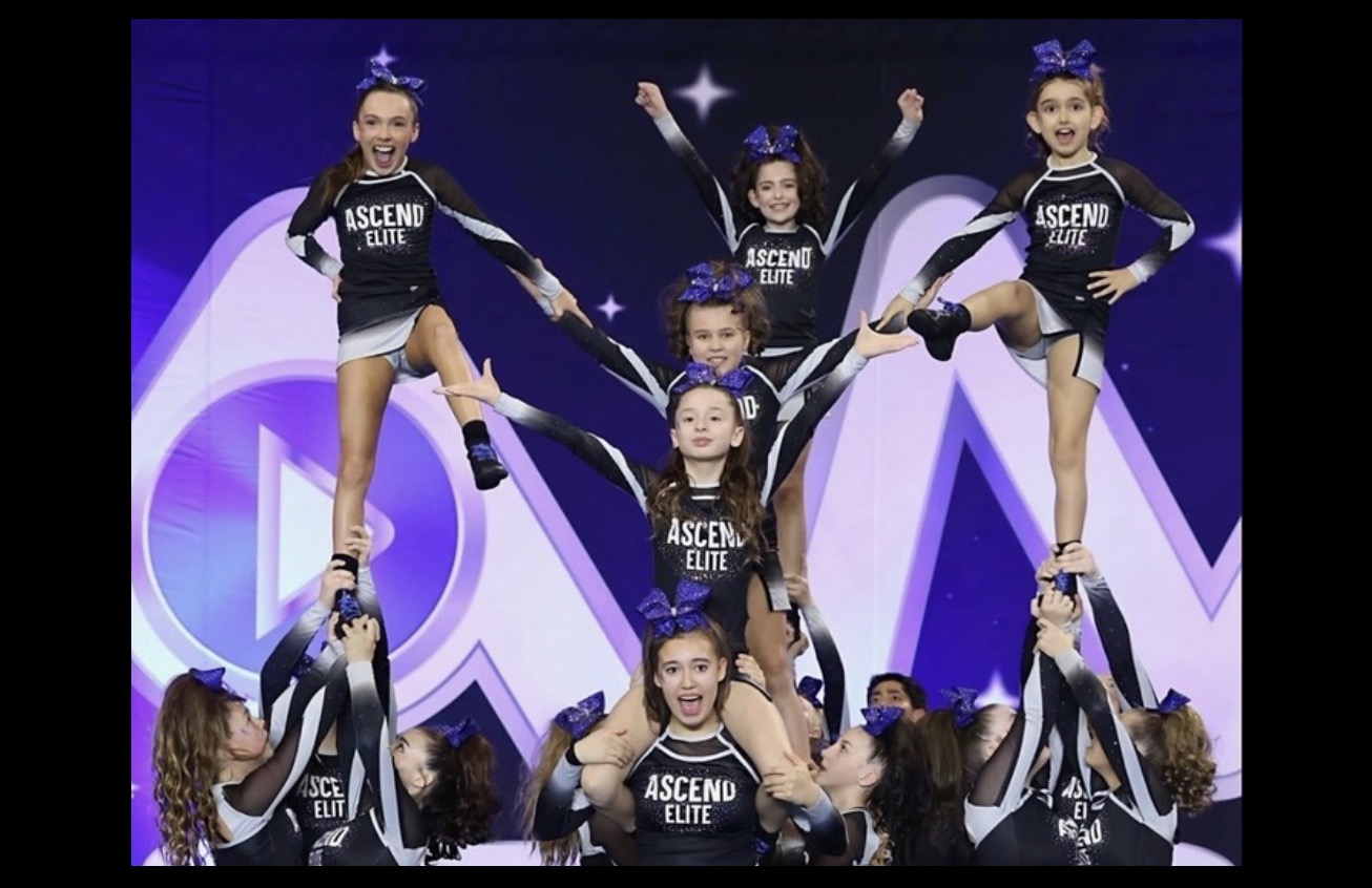 Ascend Elite Cheer athletes performing a team pyramid on the competition floor