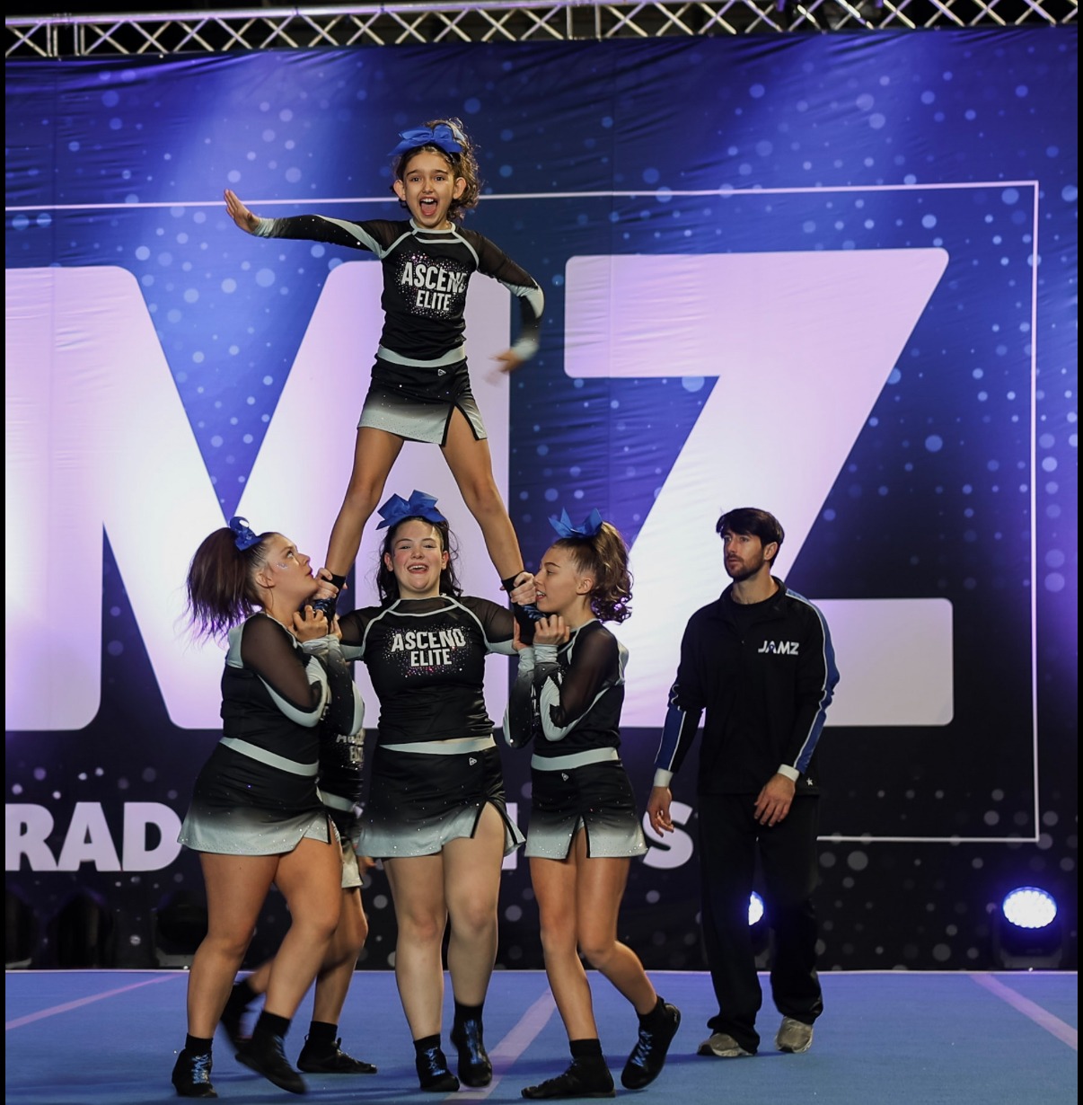 Ascend Elite Cheer stunt group performing together at a JAMZ competition